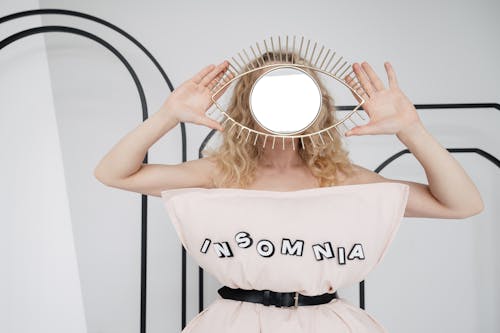 Free Woman Holding a Mirror Stock Photo