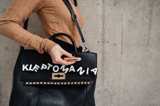 Woman Carrying a Leather Bag