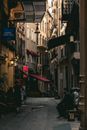 People on an Alley between Buildings