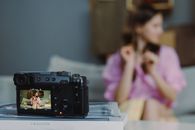 Black Dslr Camera on White Table