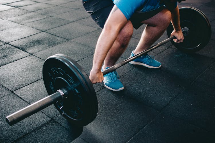 Man Holding Barbell