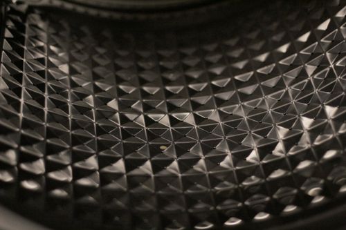 Free Detailed image of a textured black surface with geometric patterns and reflective qualities. Stock Photo