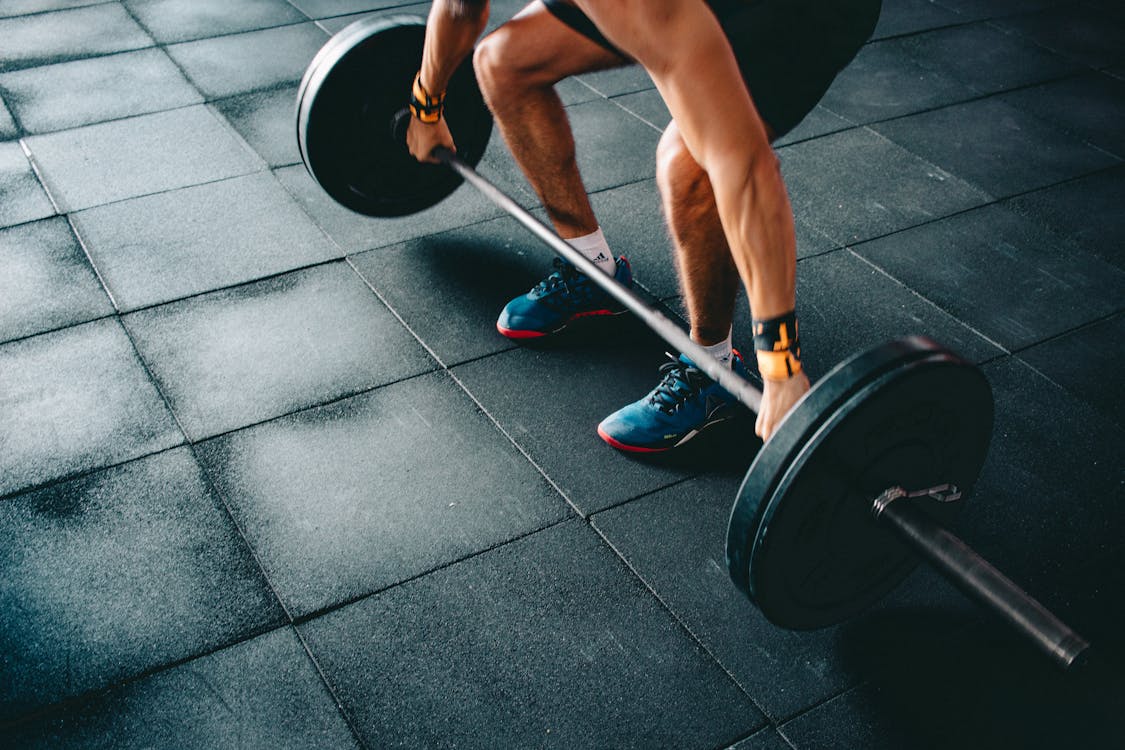 Free Person Holding Barbell Stock Photo