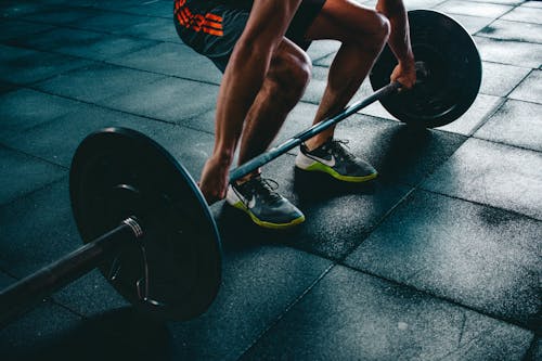 Free Person Holding Barbell Stock Photo