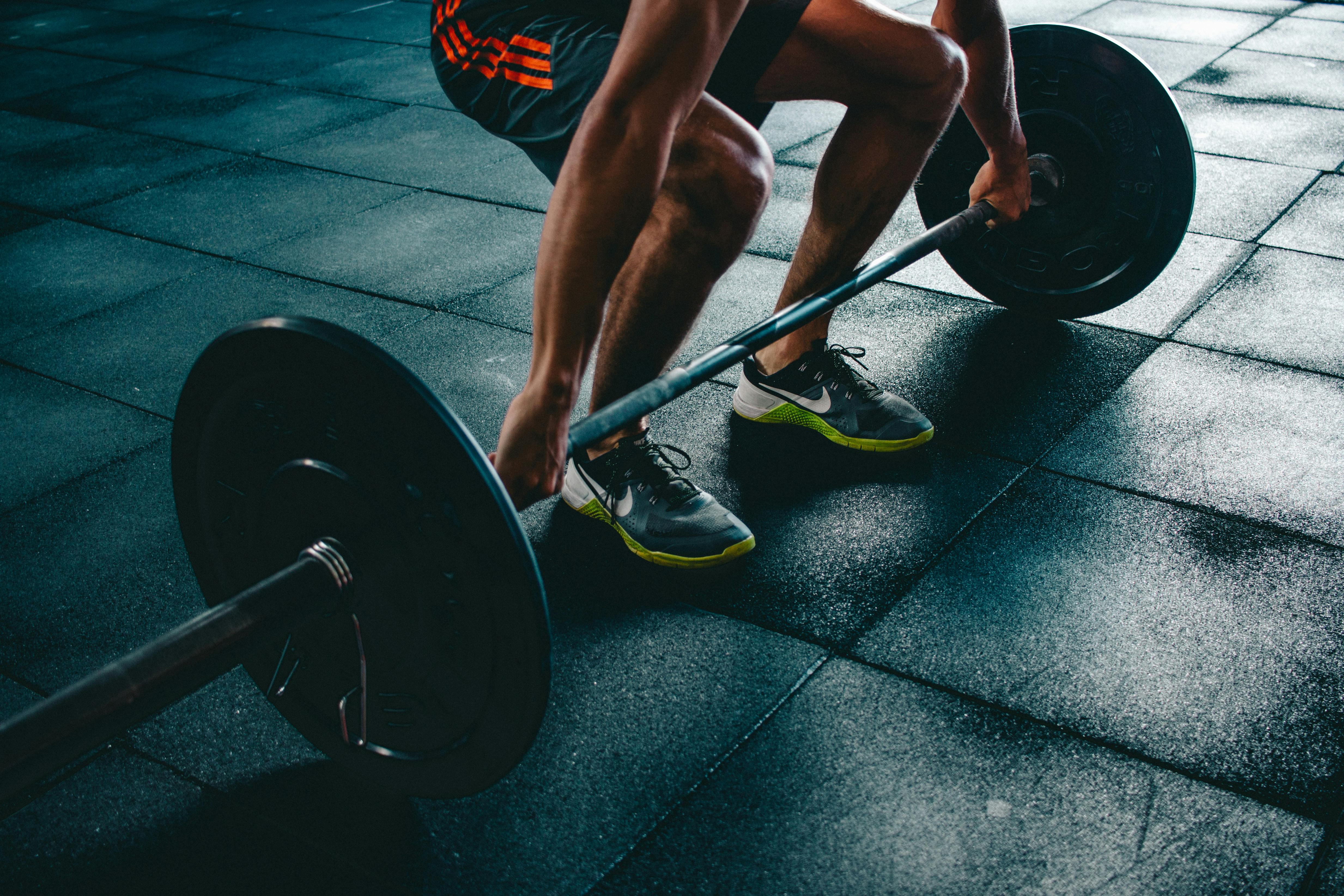 Person Holding Barbell \u00b7 Free Stock Photo