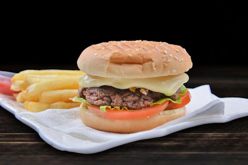 Free Burger With Lettuce and Tomatoes Stock Photo