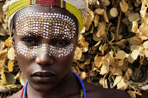 Close-up Photo of Man with Face Paint 