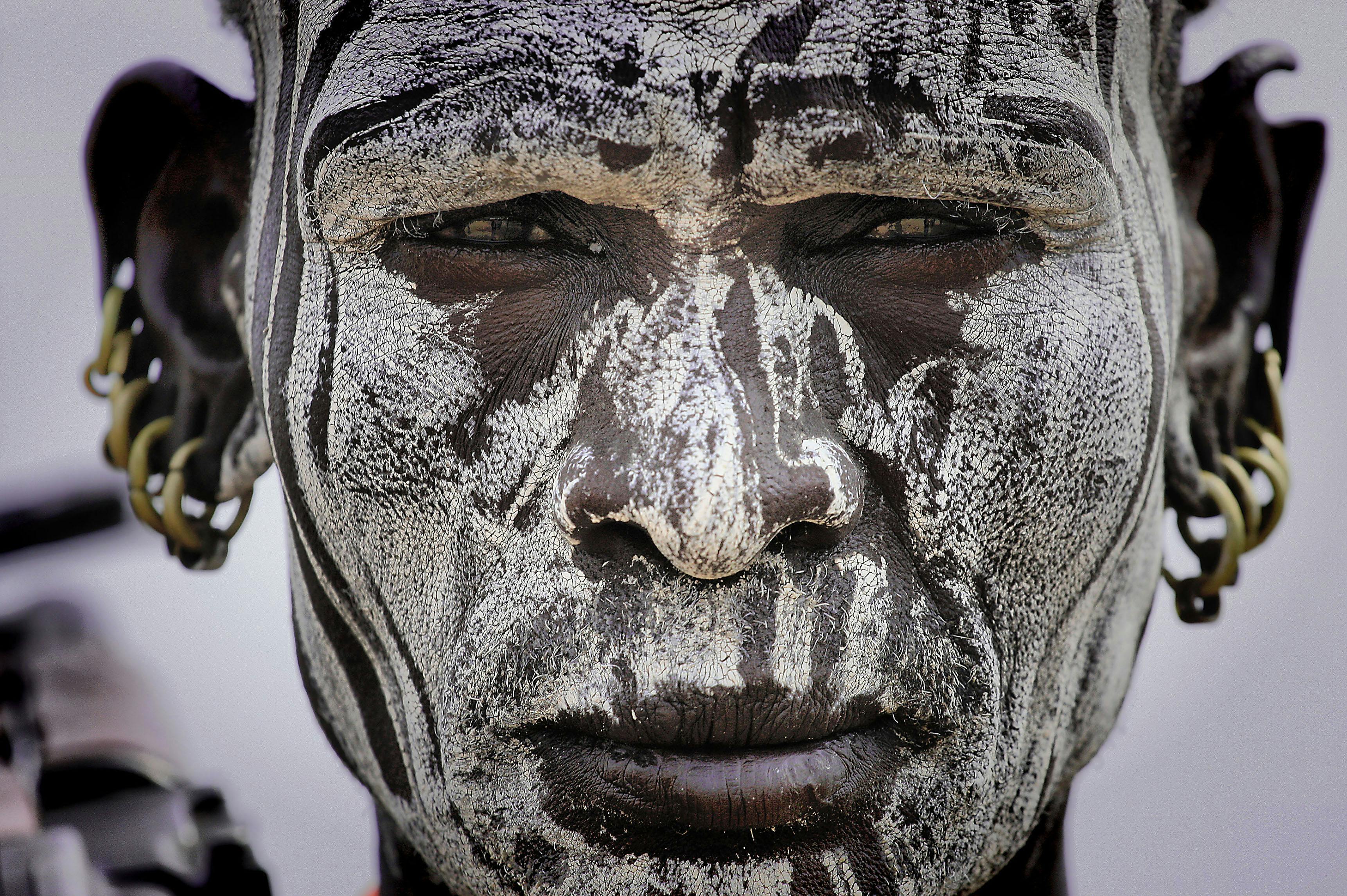 close up photo of man with face paint