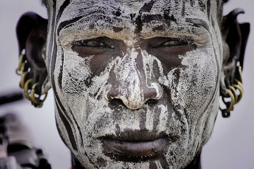 Close-up Photo of Man with Face Paint