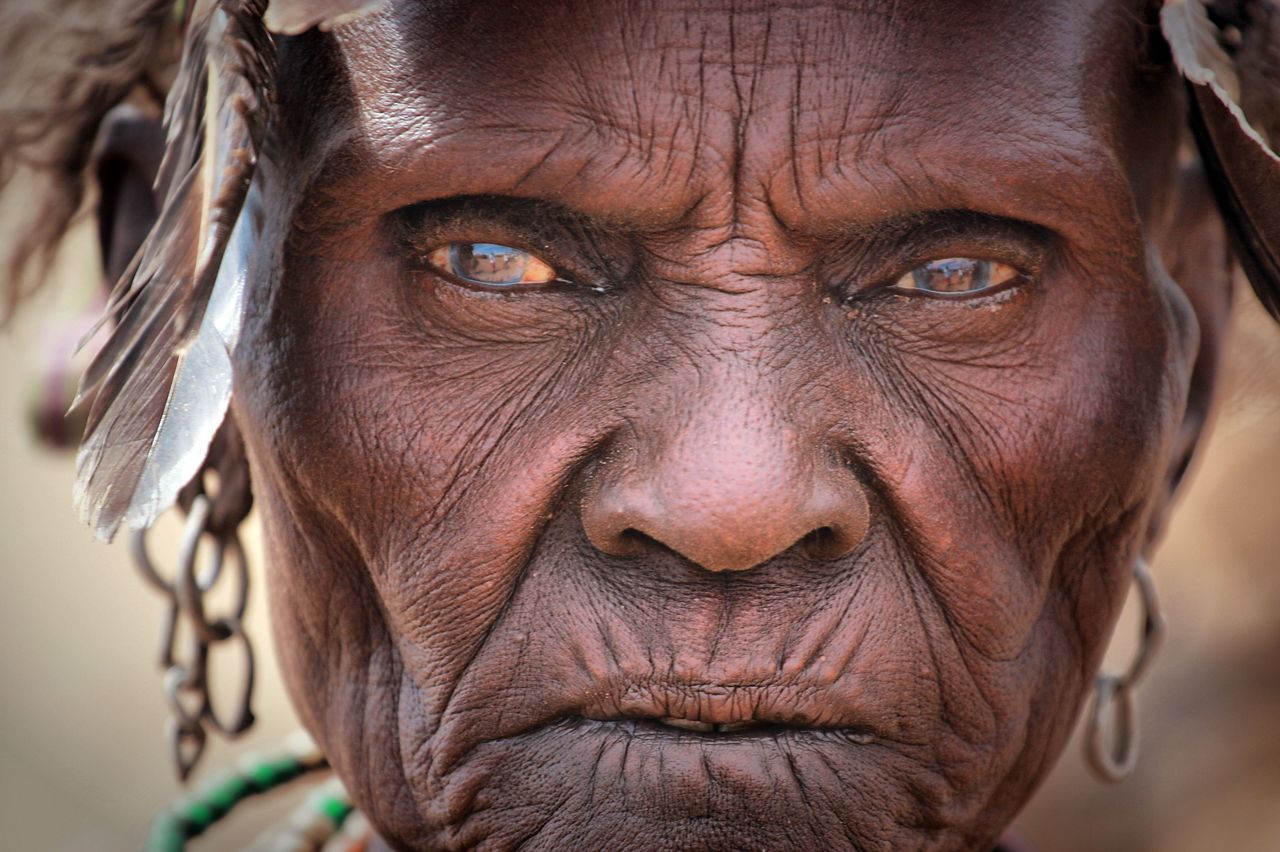 detailed face of an elderly woman showcasing deep wrinkles and traditi