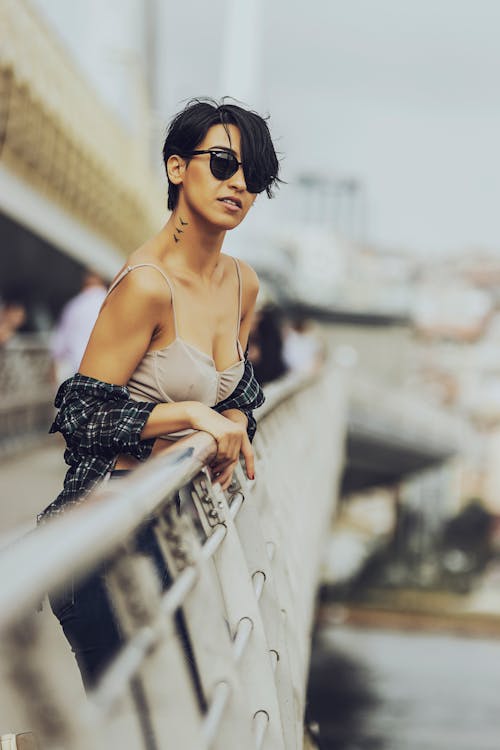 Woman Standing Against a Railing