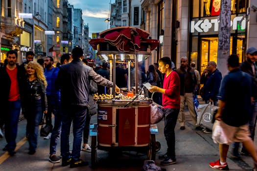 A vibrant street food vendor serving customers in a busy urban setting, capturing the night ambiance.