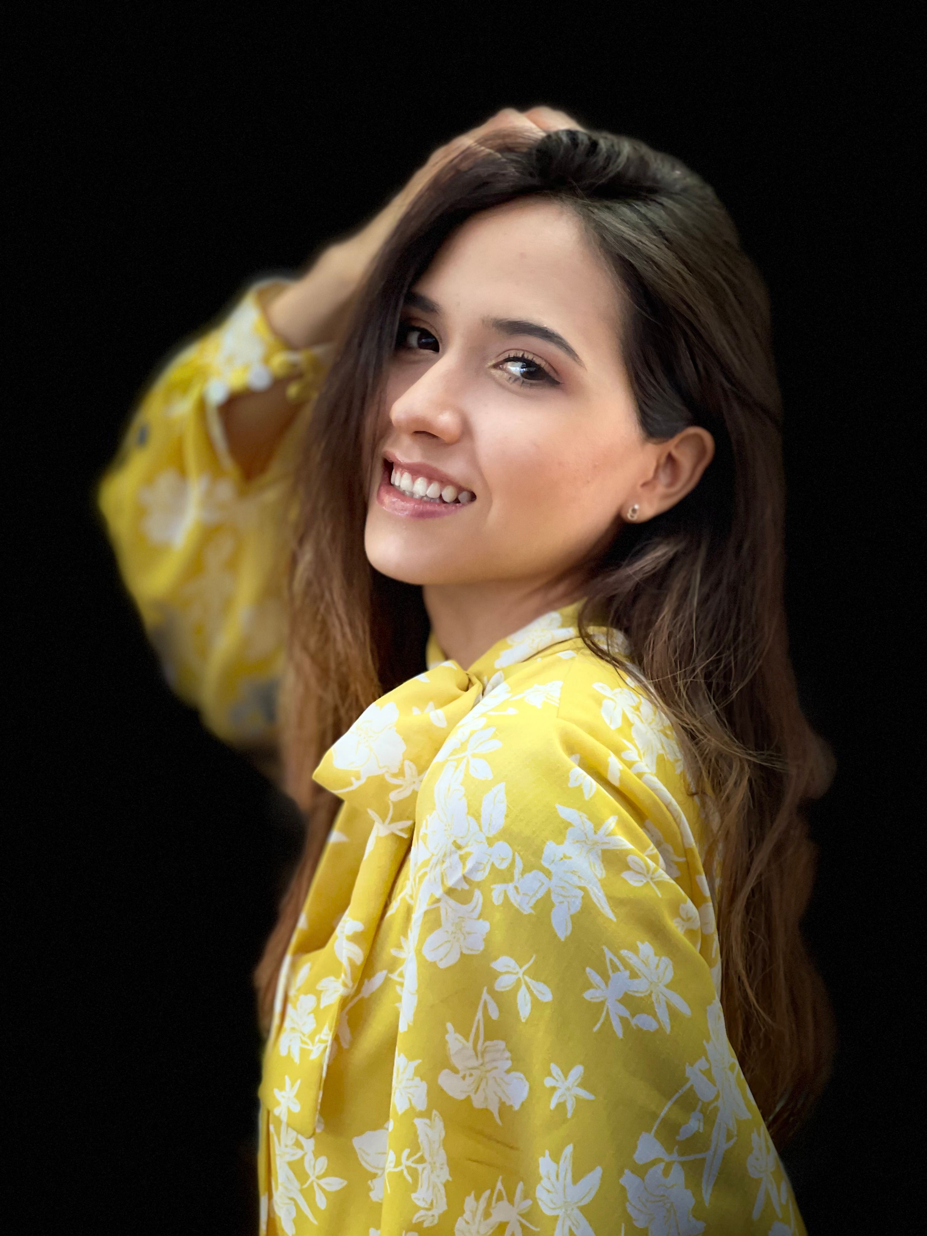 Woman in Yellow and White Floral Shirt Smiling · Free Stock Photo