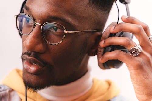 Close-up Photo of Man using Headphones 