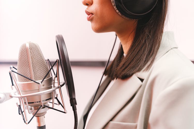 Female Artist Doing A Music Recording