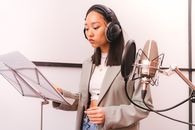 Woman Wearing Gray Blazer on a Recording Studio