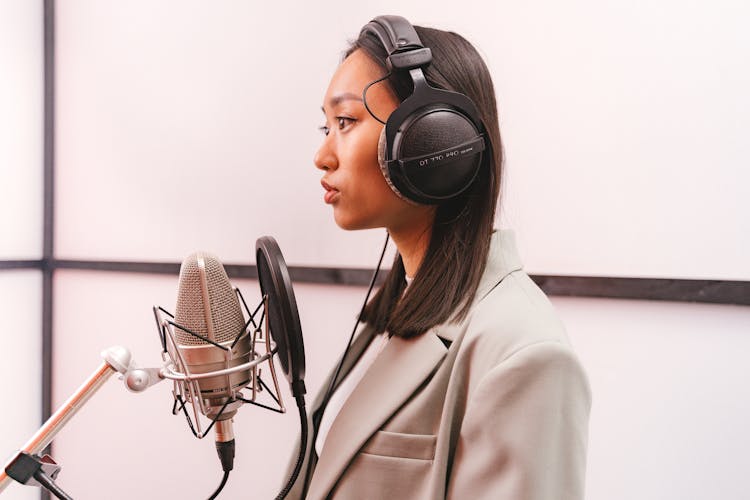 Female Artist Doing A Music Recording