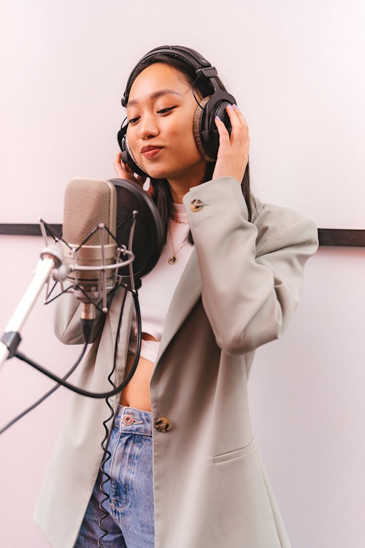 Female Artist Doing A Music Recording