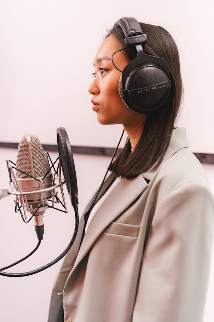 Female Artist Doing A Music Recording