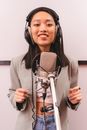 Female Artist doing a Music Recording