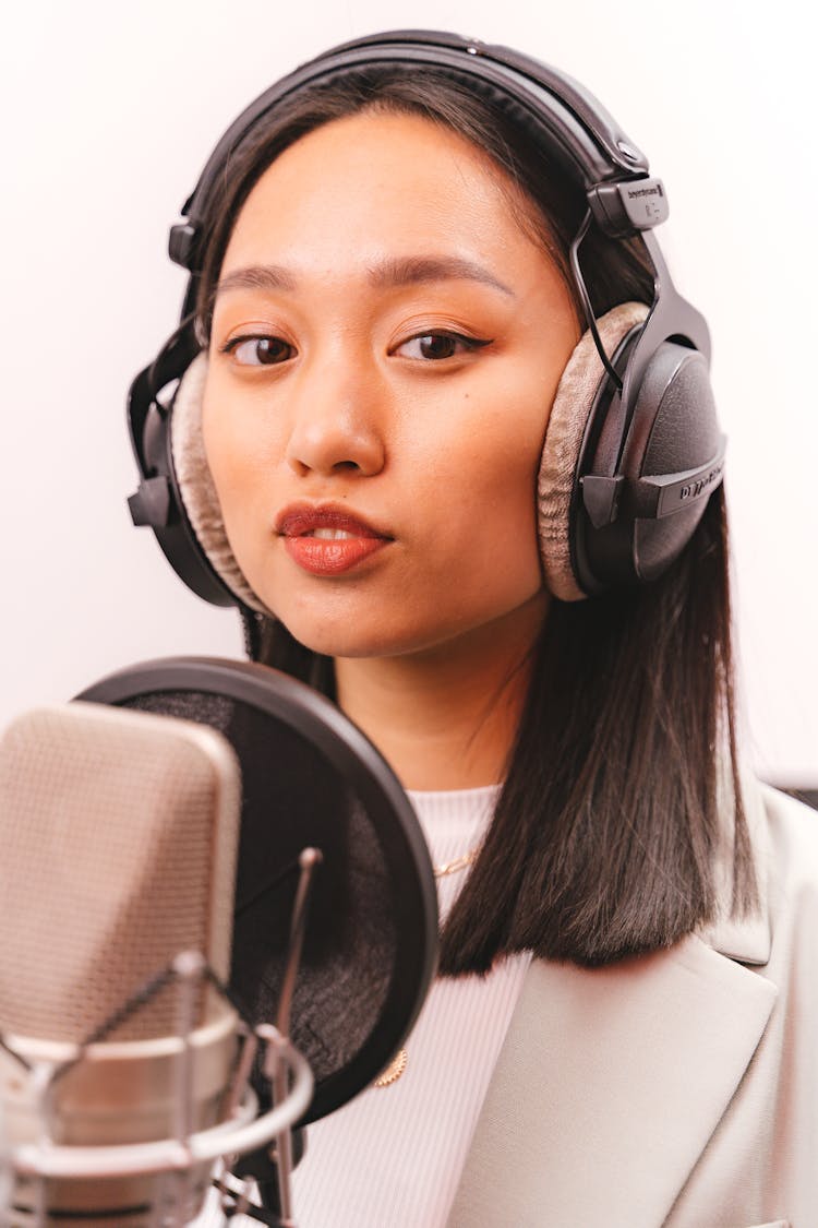 Female Artist Doing A Music Recording