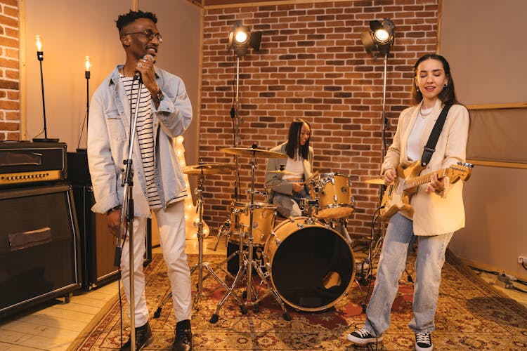 Band Performing In Record Studio