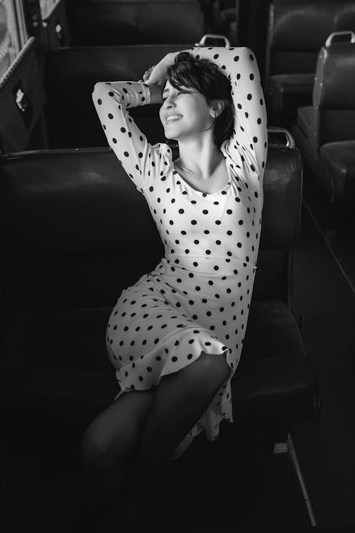 Alluring Woman in White Polka Dots Dress