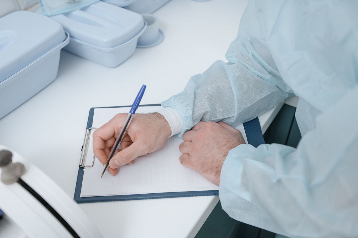 Infection prevention professional reviewing a compliance checklist