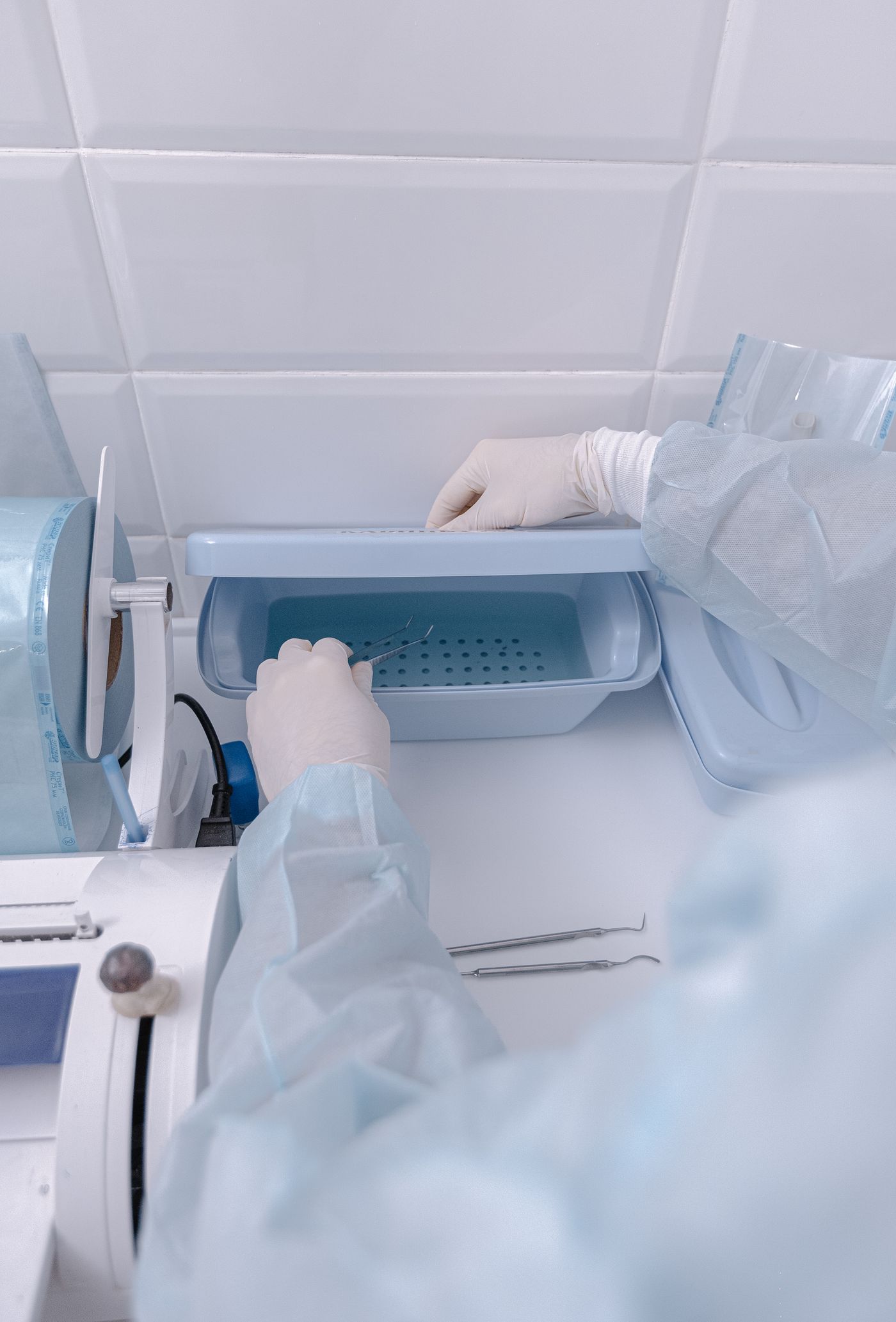 Laboratory professional handling a shipment of sterile vials