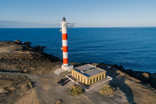 Free Lighthouse at the Coastal Area Stock Photo