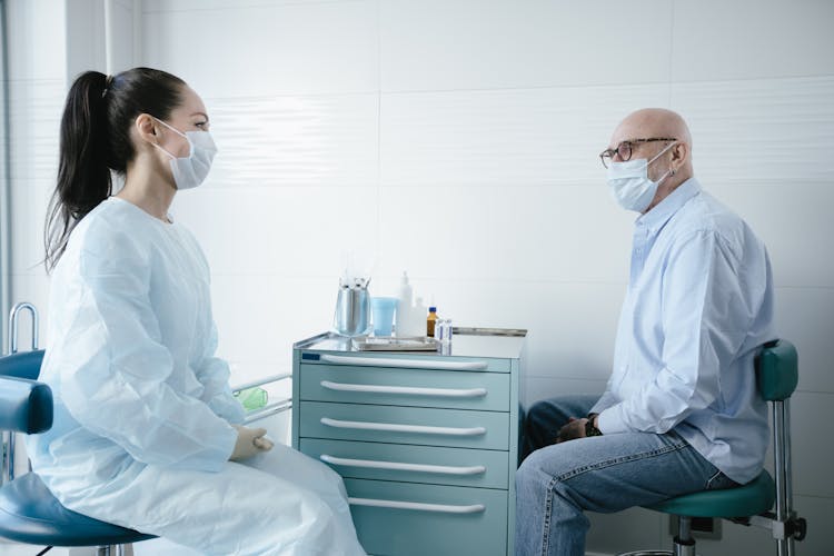 A Man Consulting A Doctor