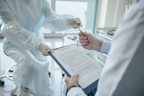 Free Doctor handing a Document  Stock Photo