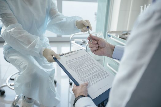 Doctor handing a Document 