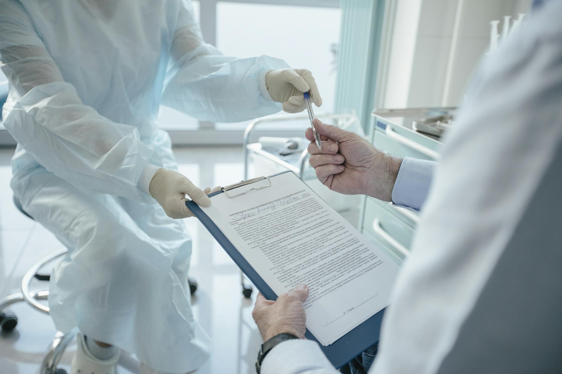 Doctor handing a Document