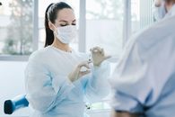 Woman in White Dress Shirt Wearing White Face Mask