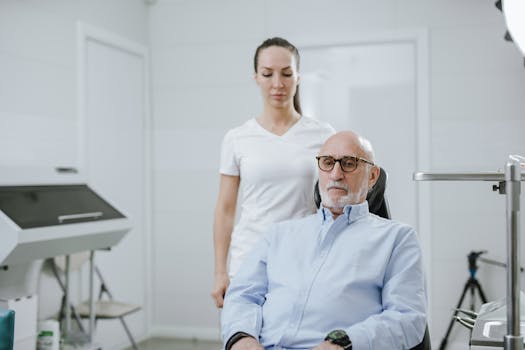 A doctor and senior patient in a modern medical clinic setting.