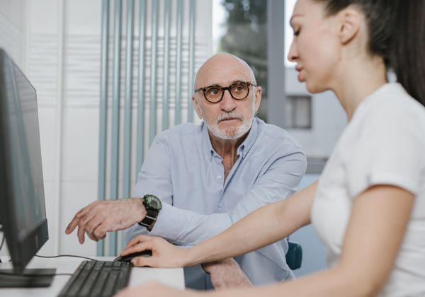 Doctor consulting with elderly patient