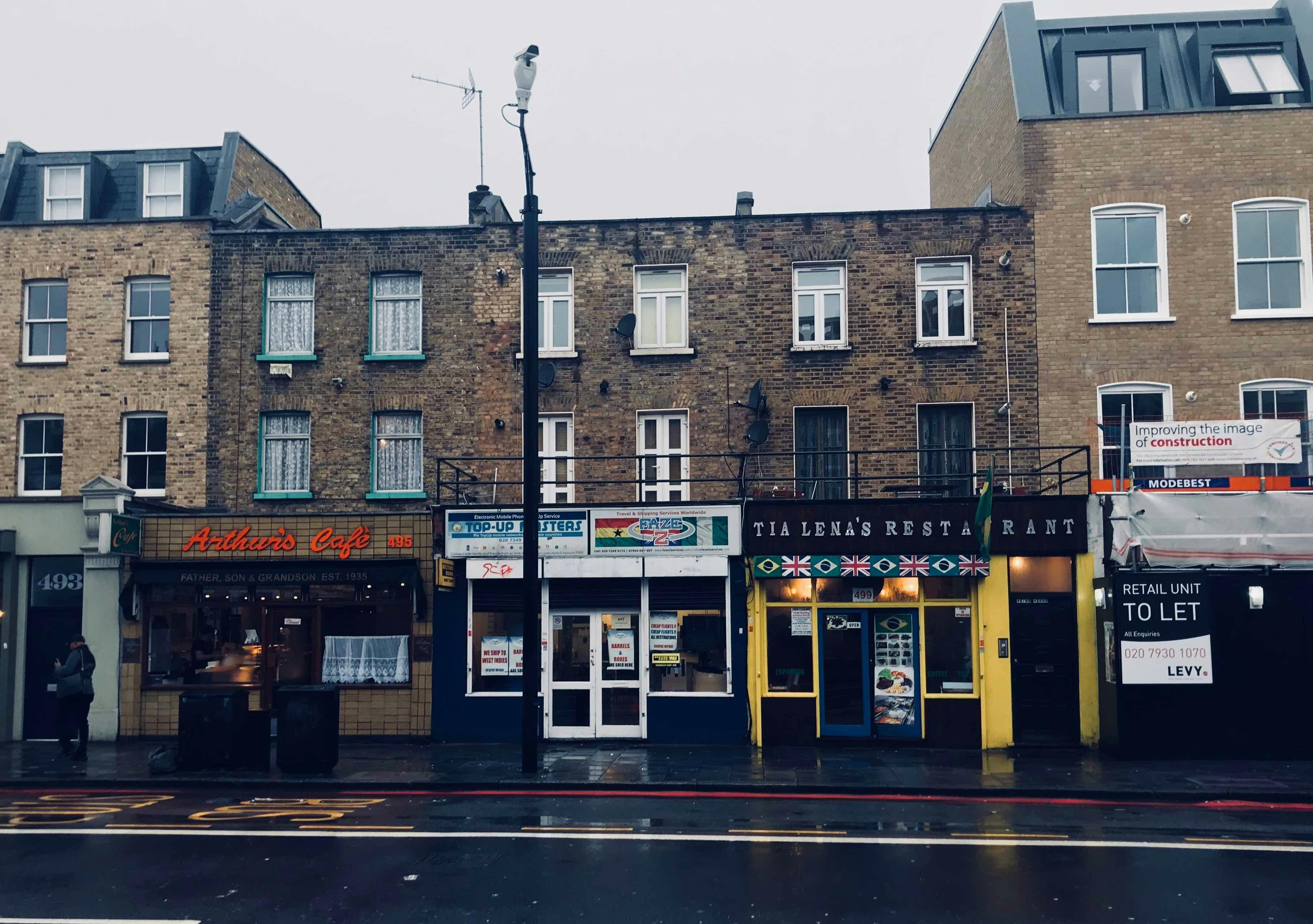 Family sitting together at home, one member feeling unwell
