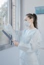 Woman in White Long Sleeve Shirt Wearing White Framed Eyeglasses