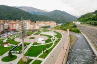 Aerial View of City Buildings Near Green Grass Field