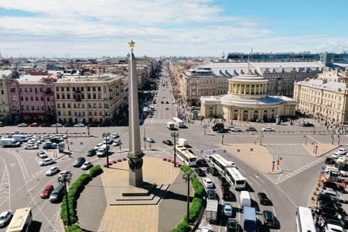 Free Aerial view of a bustling urban area with a central monument and heavy traffic. Stock Photo