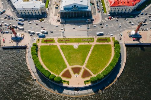 Free Aerial capture of a lush park surrounded by roads and waterways. Stock Photo