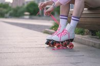 Person in White Socks and Red Nike Sneakers