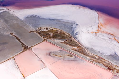 Free Stunning aerial photograph of colorful salt ponds showcasing vivid patterns in nature. Stock Photo