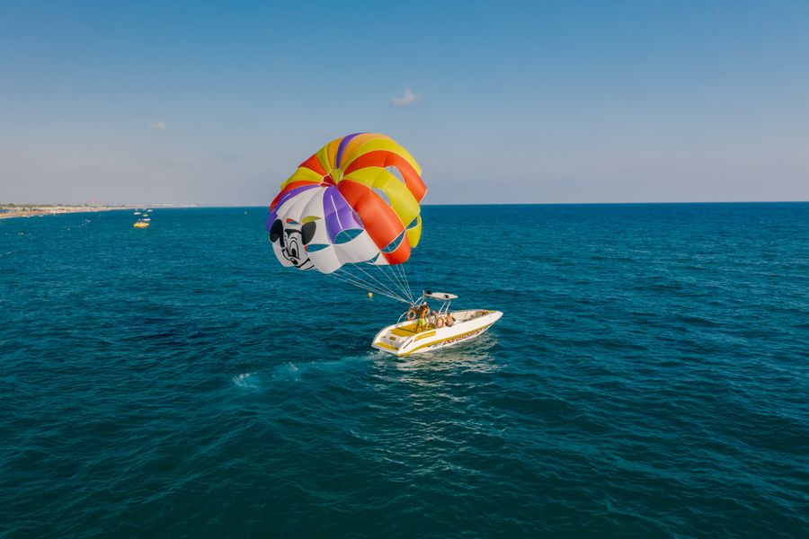 A parasailer lifting off above the Red Sea