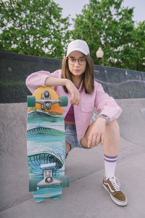 Free Close-Up Shot of a Woman with a Skateboard Stock Photo