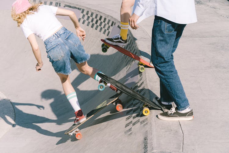 People Riding Skateboards On A Ramp