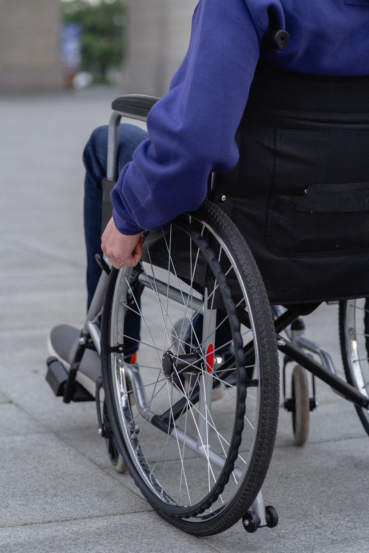Person using a wheelchair outdoors