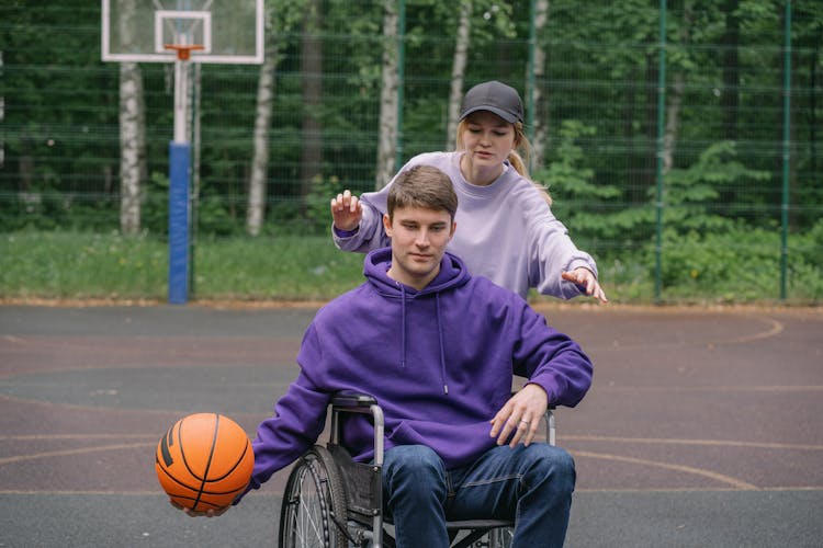 A Couple Playing Basketball 