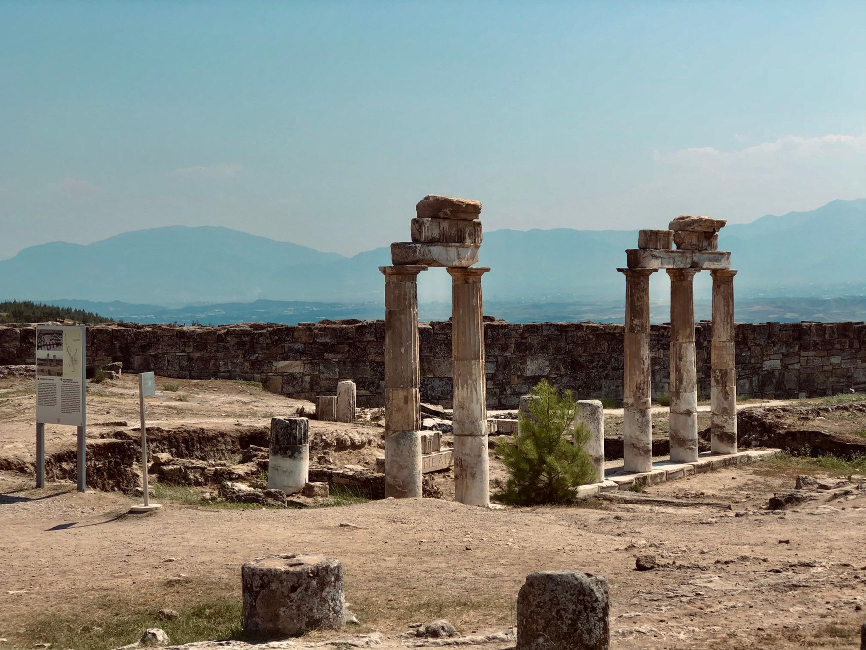 View of ancient columns and ruins at Hierapolis, an iconic historic site in Turkey.
